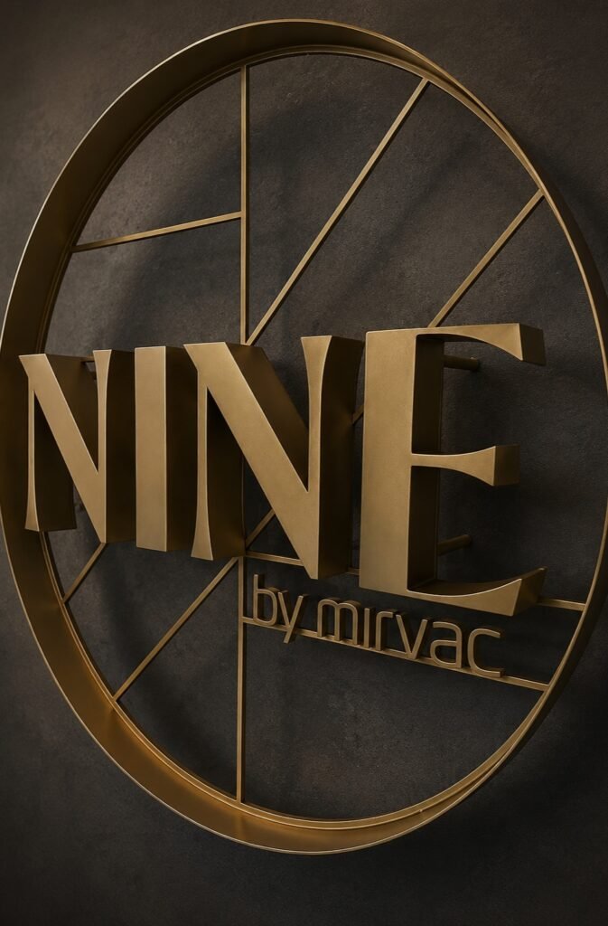 NINE by Mirvac gold ring brand signage — Black Sheep Pro